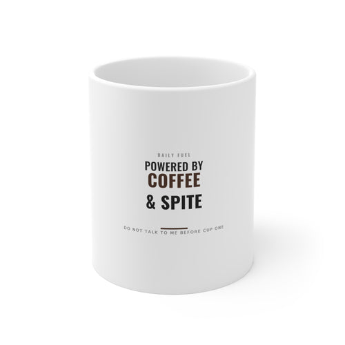 Powered by Coffee and Spite white ceramic mug on a plain background